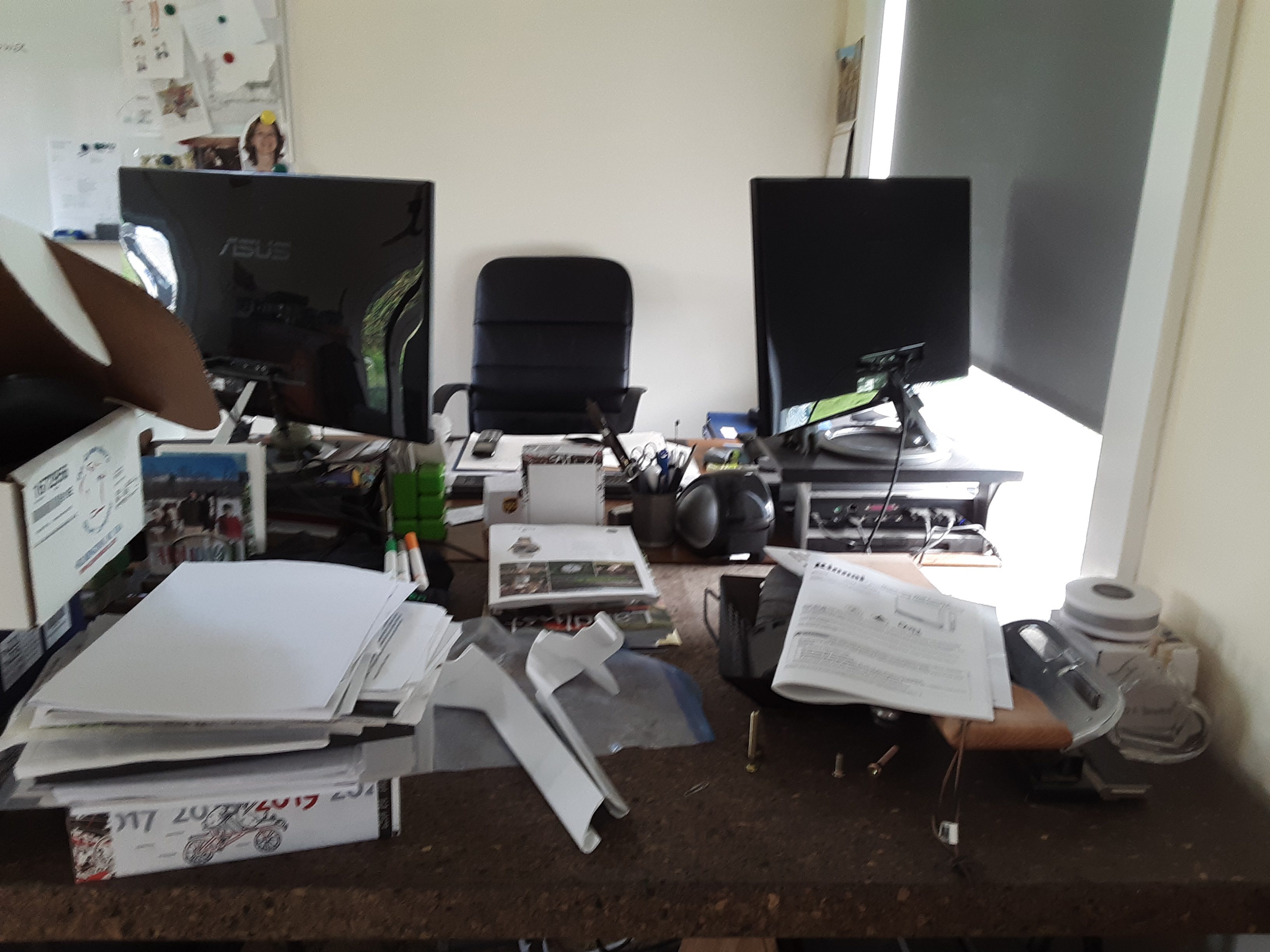 Two desks before we cleared their clutter