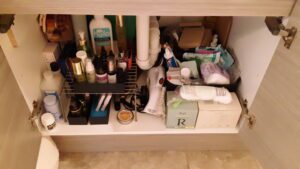 Below-sink clutter cleared, with help from De-clutter Me!