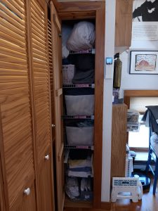 The cluttered linen closet, before we cleared it, with help from De-clutter Me!
