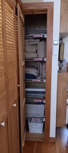 The narrow linen closet being used better